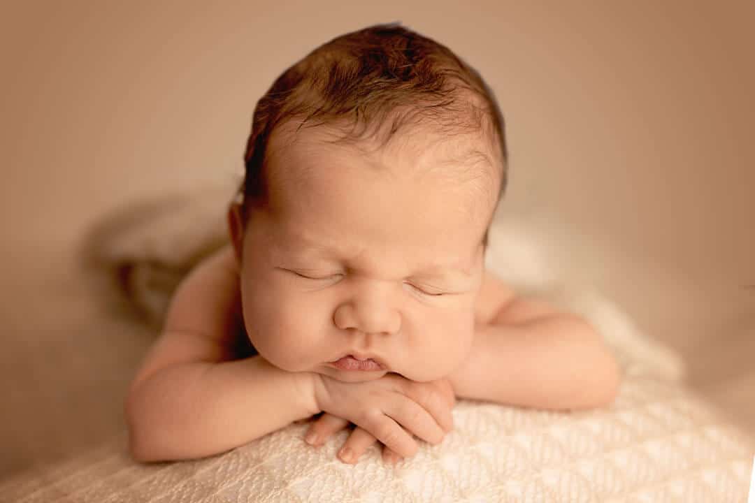 newborn chin on hands sleeping. iris lane photography akron canton ohio