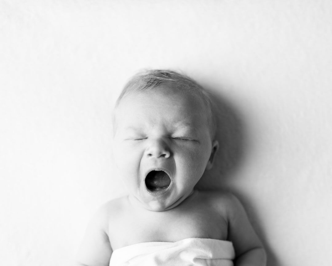 newborn yawning black and white.  iris lane photography akron canton green hartville ne ohio